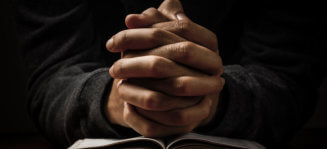 hands on praying sign